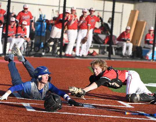 Boston Hinkle safely slides into home, giving the Titans their only run on Thursday. NCJ photo by Rick Holtz