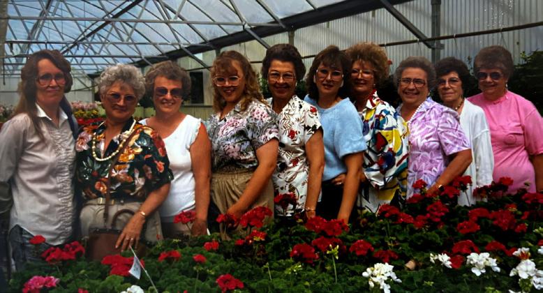The 1990 group photo taken at a greenhouse in Kearney.